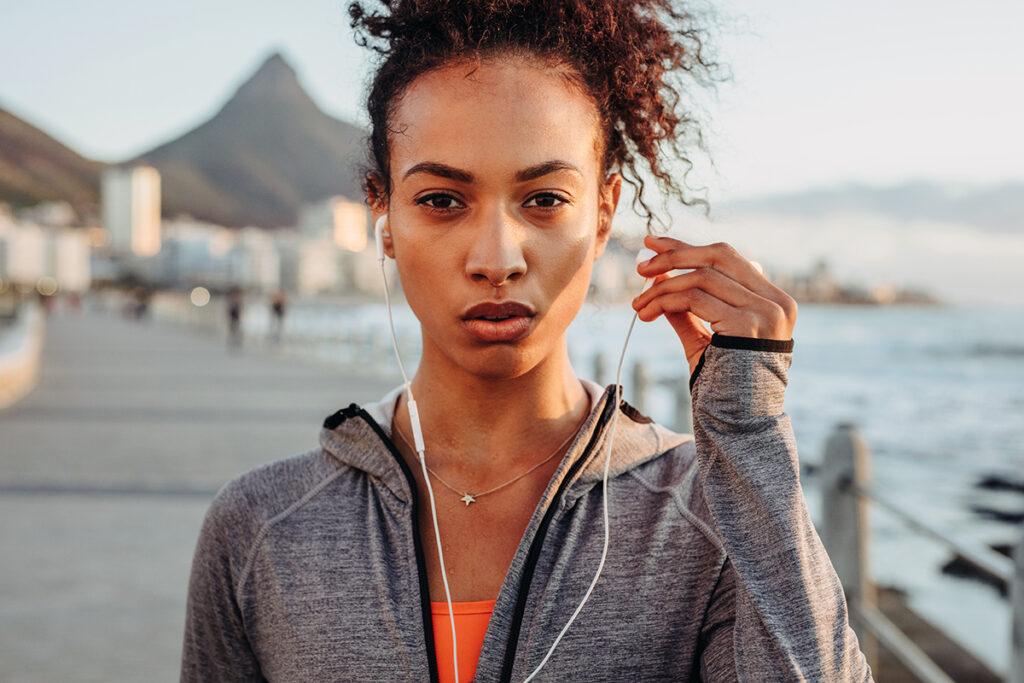 Woman about to workout listening to music