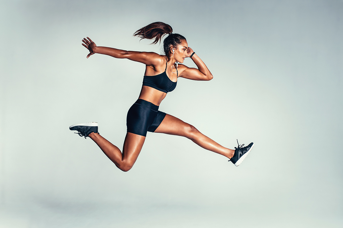 Woman with a mesomorph body type jumping