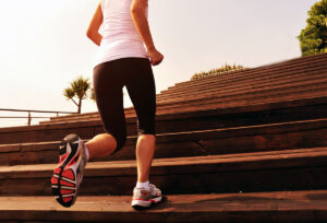 Stair climbing woman working out