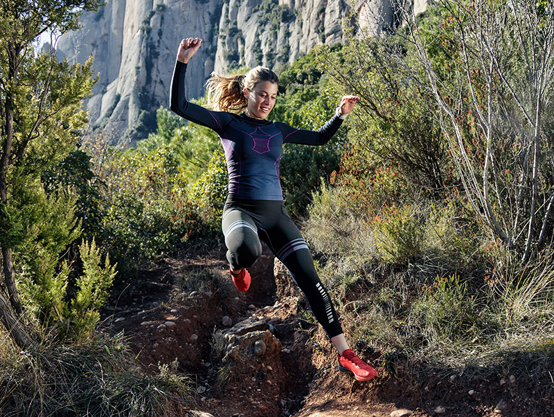 Female runners doing fartllek workout on trail