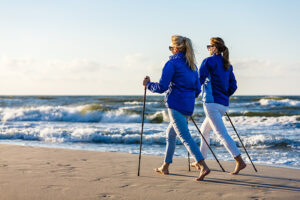 Women Nordic walking on beach