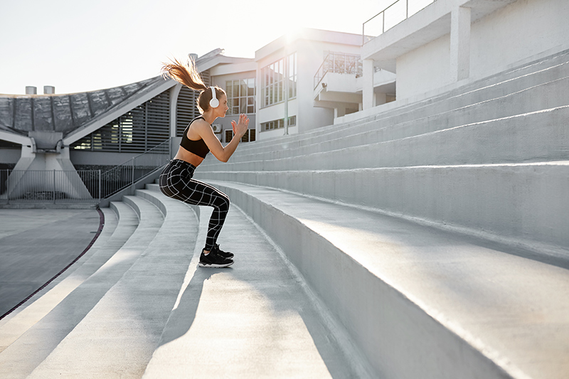 Woman doing HIIT Stair climbing Workout