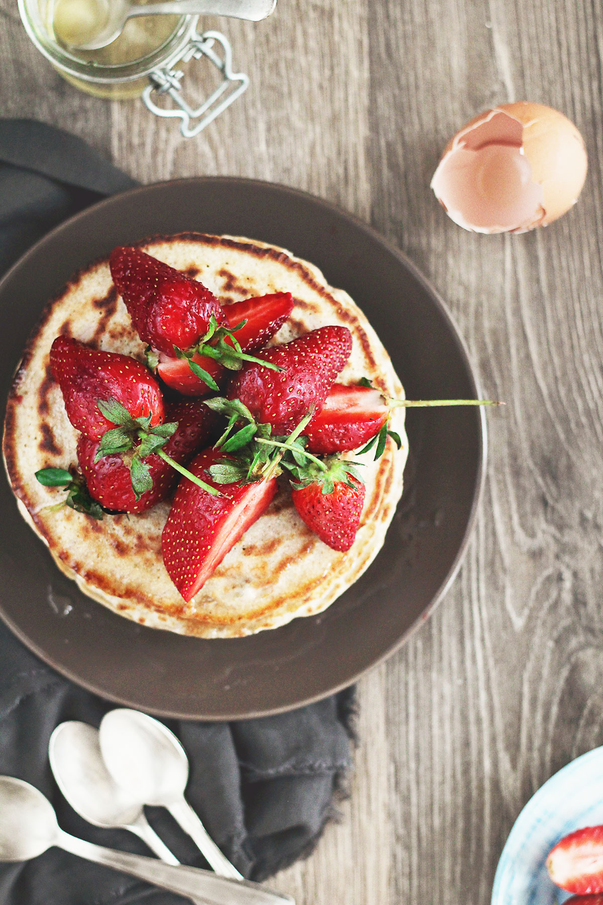 Healthy pancakes with strawberries on a plate