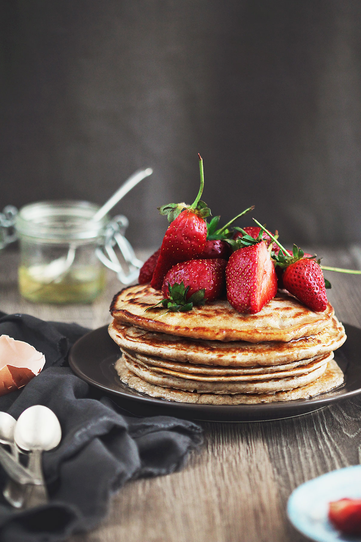 Healthy pancakes with strawberries on a plate